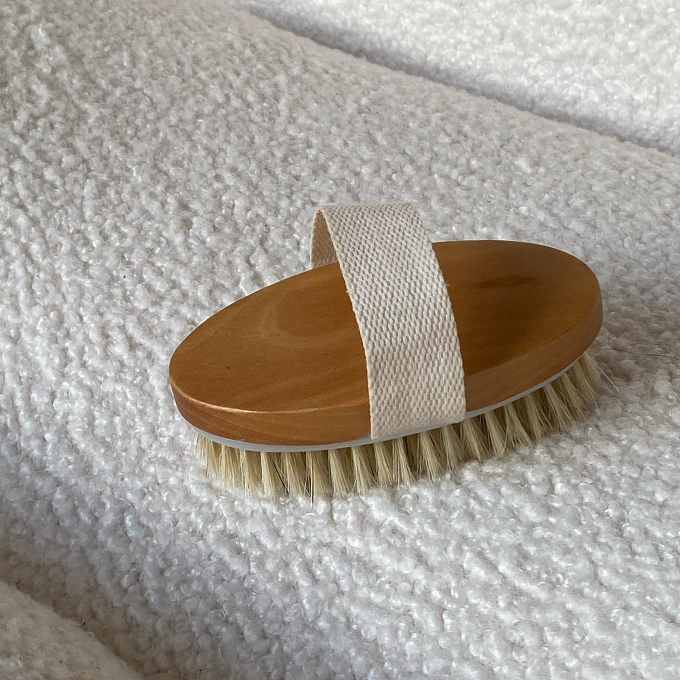 <img src="dry-brush.jpg" alt="Revive Dry Body Brush with natural bristles and cotton strap for exfoliating and improving circulation by ami london">