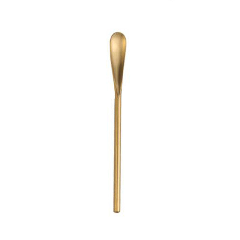 Eco-friendly gold skincare applicator spoon, designed for neat and waste-reducing application of skincare products.