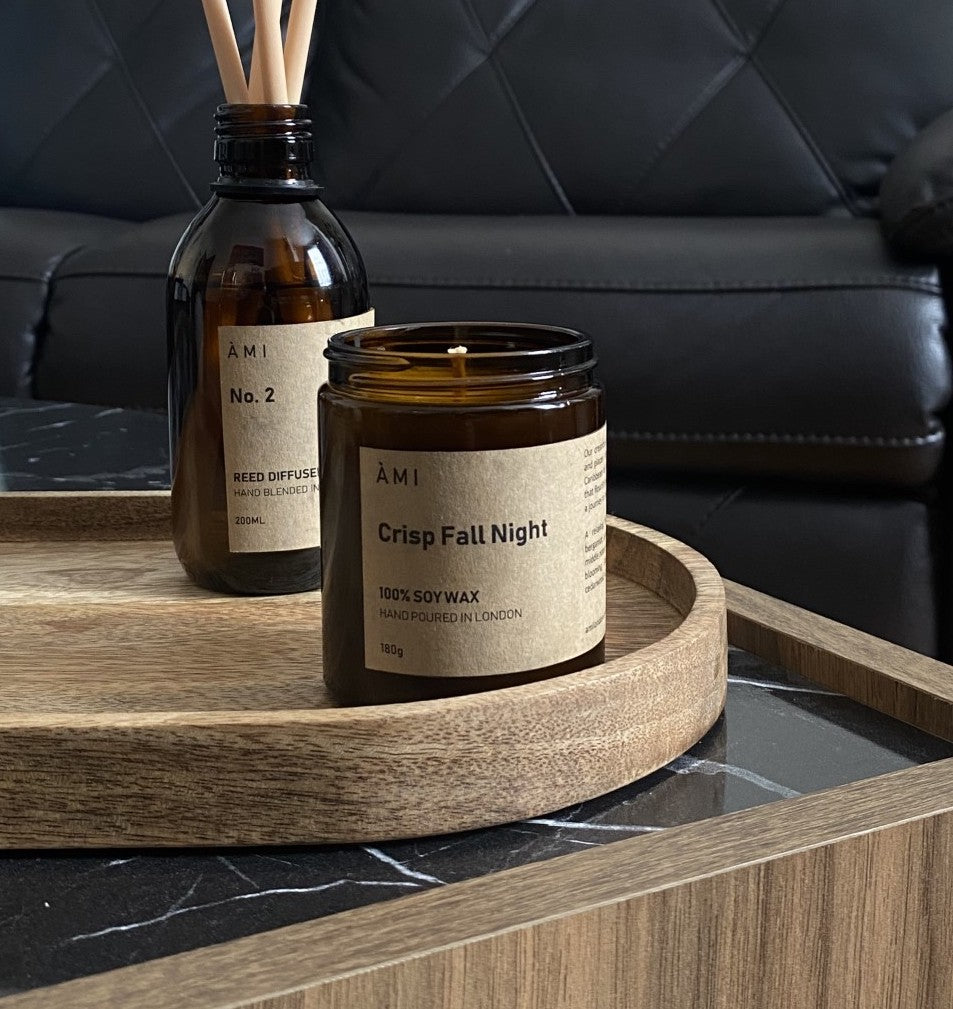 <img src="woodland-harmony-candle-lifestyle.jpg" alt="Woodland Harmony Soy Wax Candle lit in a cozy living room, creating a calming atmosphere with natural fragrance">